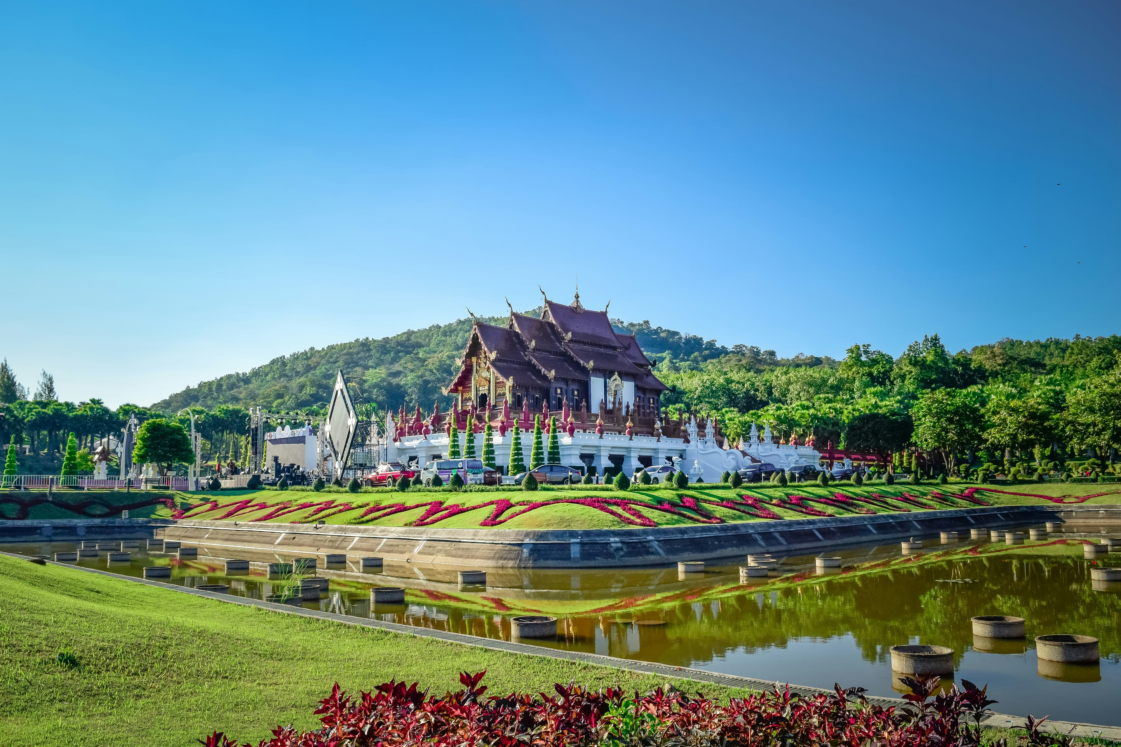 Scenic view of Chiang Mai, Thailand with temples and mountains.
